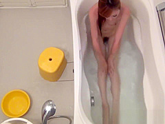 Tiny asian teen rubbing her pussy