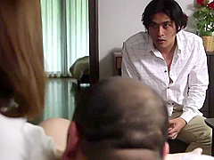 Busty Japanese woman is cuckolding her husband and getting a bit too excited about doing it