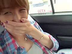 Timid Asian woman enjoys herself in the car