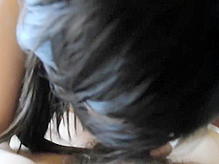 Innocent Asian girl giving a blowjob