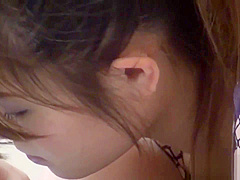 Spied on Japanese babe finger fucks her pussy