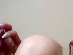 Spied on Japanese babe finger fucks her pussy