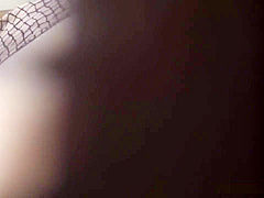 Spied on Japanese babe finger fucks her pussy