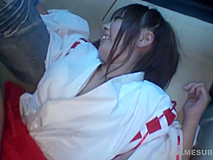 Shrine maiden in car with guys