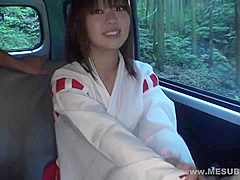 Shrine maiden in car with guys