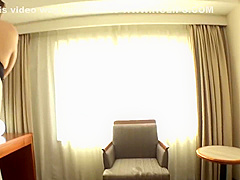 Beautiful woman wearing a seductive lingerie while shaking her big tits