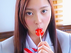Nishida Natsume sucks a lollipop in school uniform