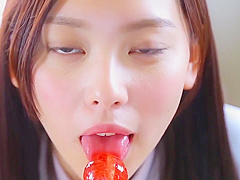 Nishida Natsume sucks a lollipop in school uniform