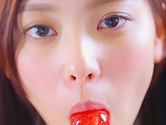 Nishida Natsume sucks a lollipop in school uniform